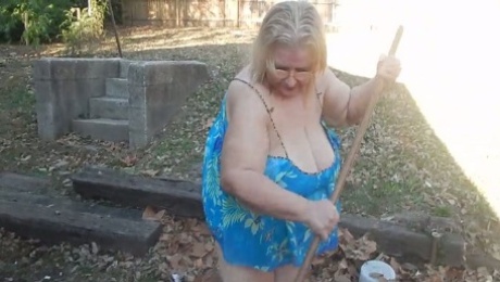 This exhibitionistic granny knows the best way to remove leaves in her yard